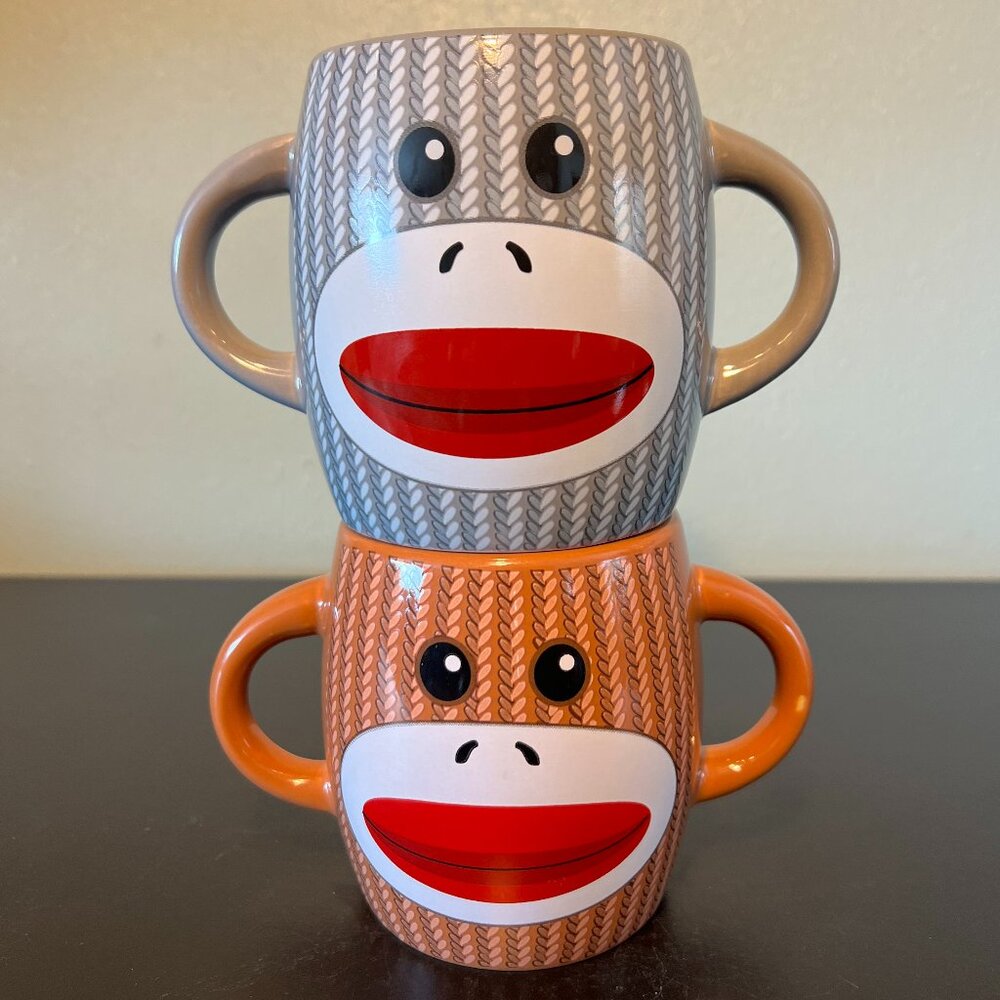 Pair of Retro Knitted Sock Monkey Ceramic Dual Handled Dual-Sided Mugs - GALERIE